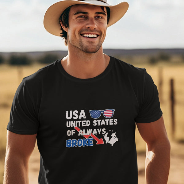 USA United States Of Always Broke graphic t-shirt with distressed black and blue text, red arrow, patriotic sunglasses, and broken piggy bank icon. Funny design for white, navy, or black shirts